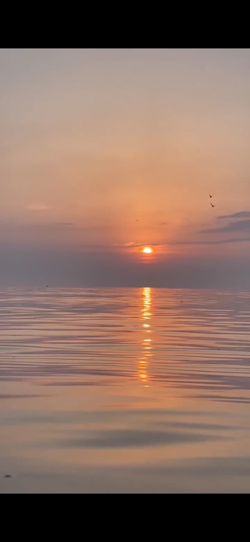 Sunset over a calm sea at Blackpool